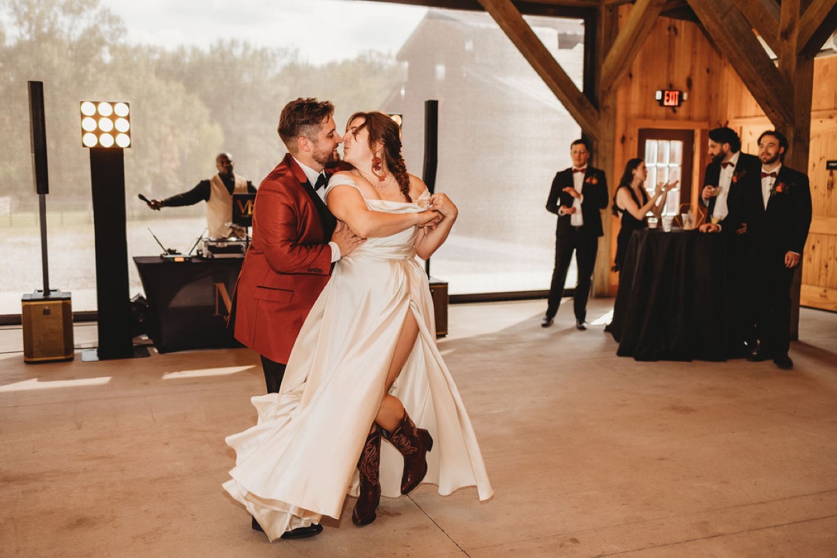 Lauren & Alex share a first dance, her cowboy boots flashing under her gown, at Covey Creek