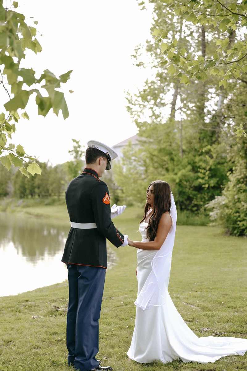 Cadence & Brody hold hands by the Pond as he reads vows in Marine dress blues under trees at Covey Creek